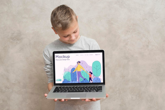 Free Front View Of Boy Holding Laptop Psd