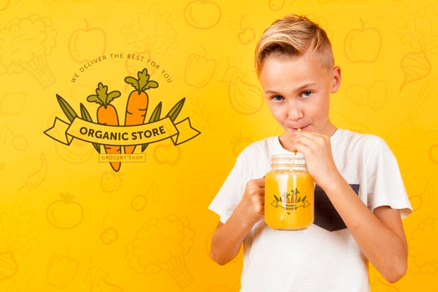 Free Front View Of Child Drinking Juice From Jar Psd