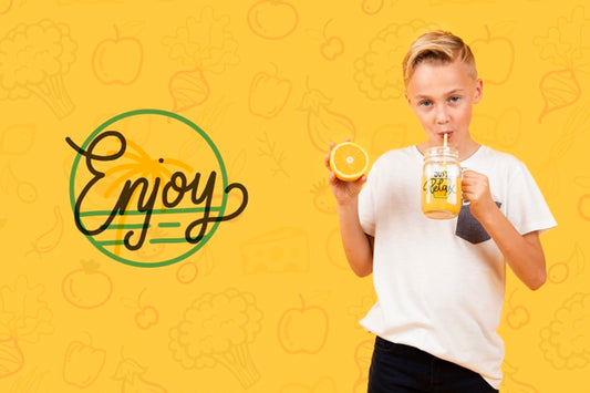 Free Front View Of Child Drinking Orange Juice Psd