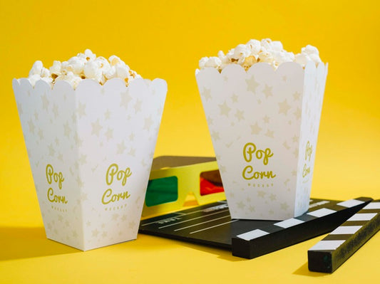 Free Front View Of Cinema Popcorn In Cups With Glasses And Clapperboard Psd