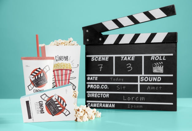 Free Front View Of Cinema Popcorn With Cup And Clapperboard Psd