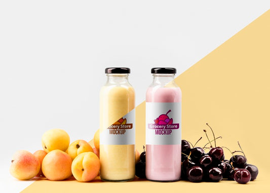 Free Front View Of Clear Juice Bottles With Cherries And Peaches Psd