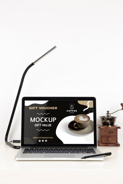 Free Front View Of Desk Surface With Laptop And Lamp Psd