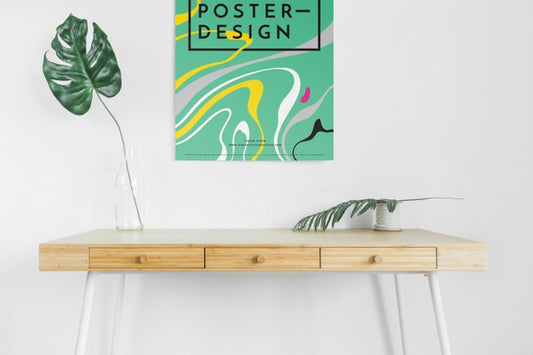 Free Front View Of Desk With Leaves And Poster Psd