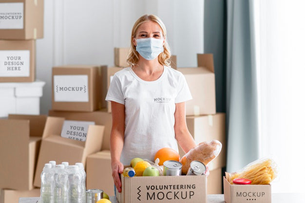 Free Front View Of Female Volunteer With Medical Mask Preparing Food Donations Psd