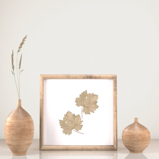 Free Front View Of Frame Decor With Vases And Flower Psd