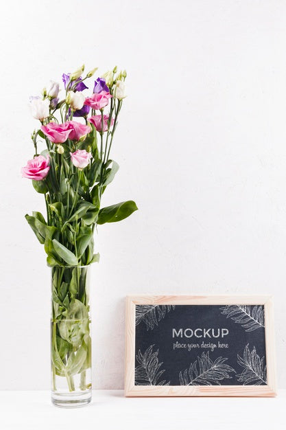 Free Front View Of Frame Mock-Up With Vase Of Flowers Psd
