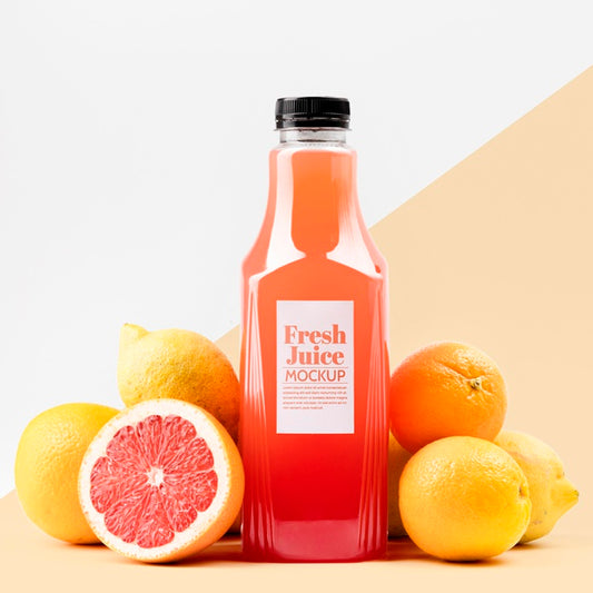 Free Front View Of Glass Juice Bottle With Grapefruit And Lemons Psd