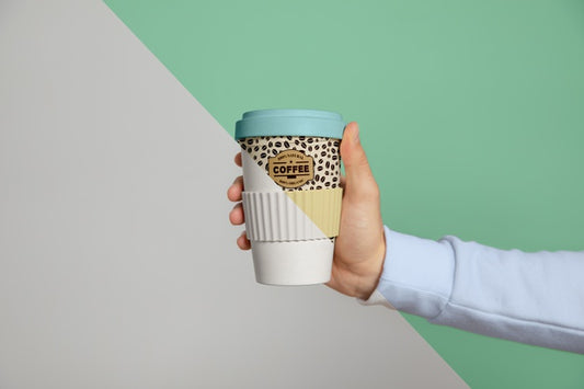 Free Front View Of Hand Held Coffee Cup Psd