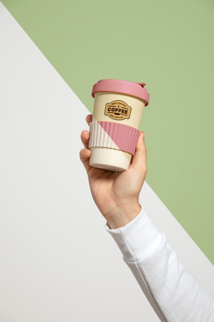 Free Front View Of Hand Holding Coffee Cup Psd