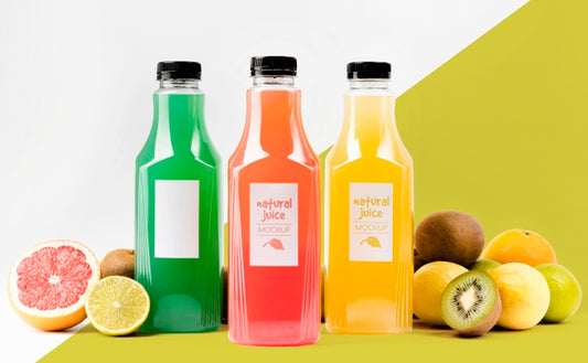 Free Front View Of Juice Bottles With Grapefruit And Kiwi Psd
