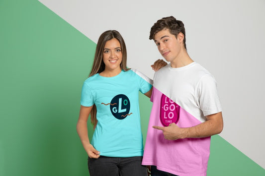 Free Front View Of Man And Woman Posing In T-Shirts And Pointing At Them Psd