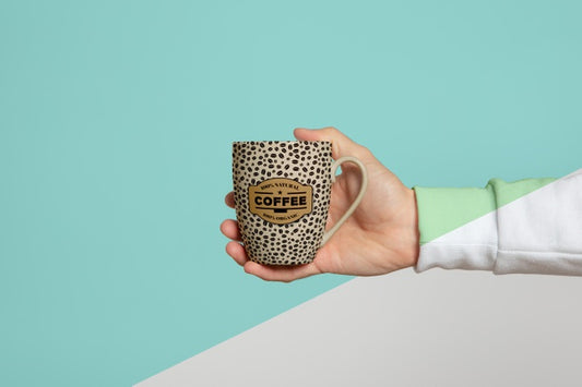 Free Front View Of Mug Held By Hand Psd