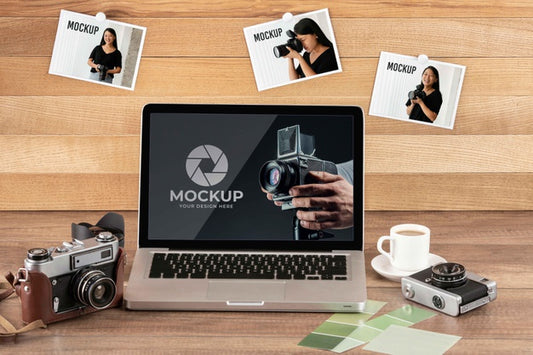 Free Front View Of Photographer Wooden Workspace With Laptop Psd