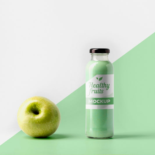 Free Front View Of Transparent Juice Bottle With Cap And Apple Psd