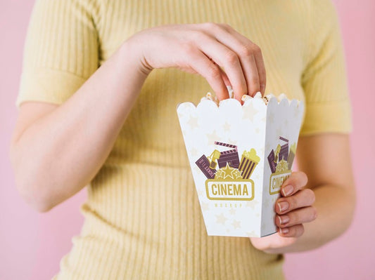Free Front View Of Woman Eating Popcorn Psd