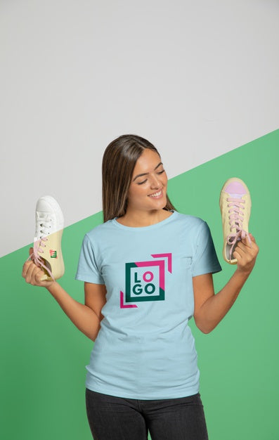 Free Front View Of Woman In T-Shirt Holding Sneakers Psd