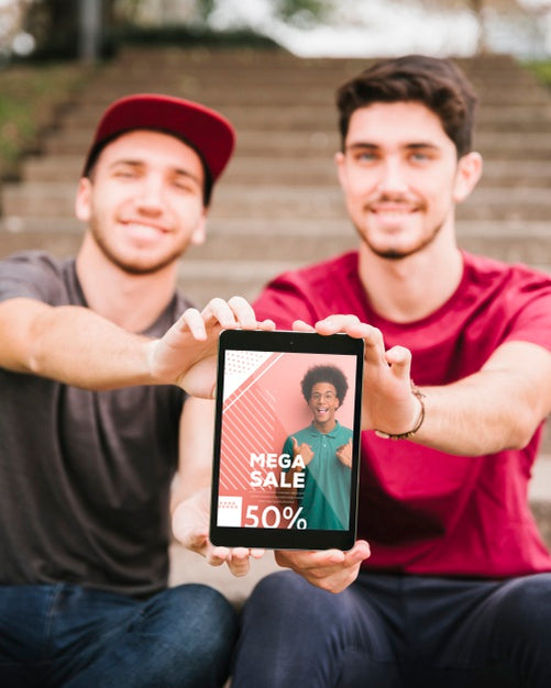 Free Front View Young Men With Tablet Outdoors Psd