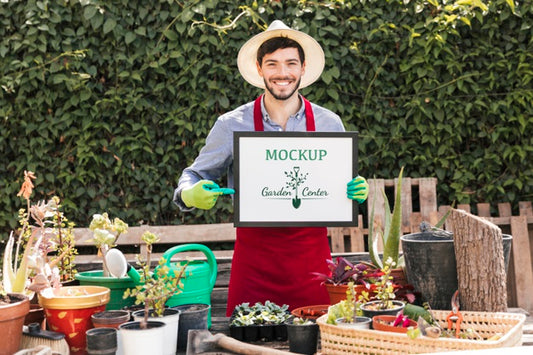 Free Gardener Holding Mock-Up Sign Psd