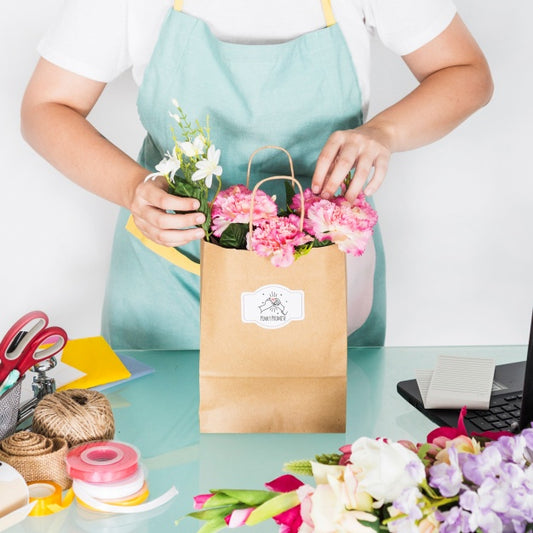 Free Gardening Concept With Woman Preparing Bag With Flowers Psd