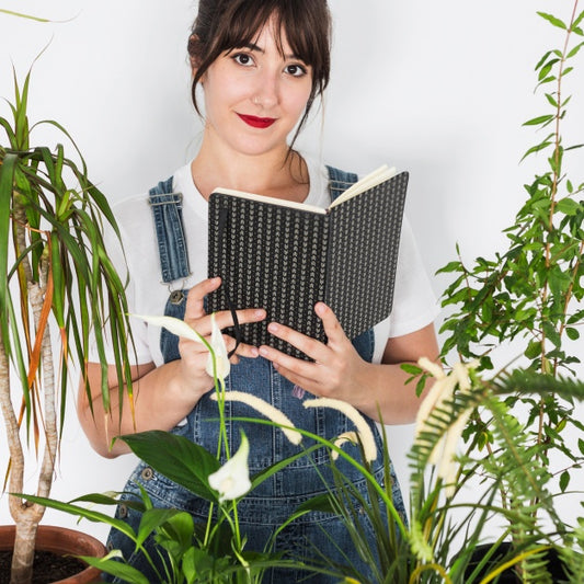 Free Gardening Concept With Woman Reading Book Psd