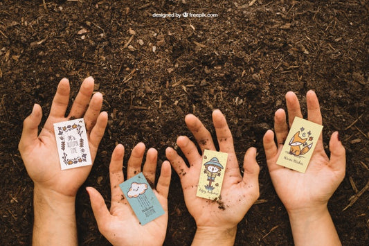 Free Gardening Mockup With Hands Holding Cards Psd