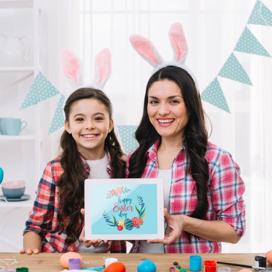 Free Girl And Mother With Tablet Mockup On Easter Day Psd