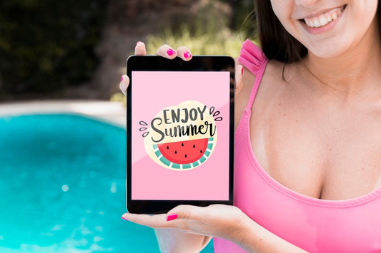 Free Girl Presenting Tablet Mockup Next To Pool Psd