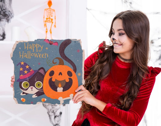 Free Girl Showing Cute Card With Cat And Carved Pumpkin Psd
