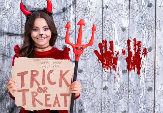Free Girl With Trick Or Treat Sign Holding The Devil Trident Psd