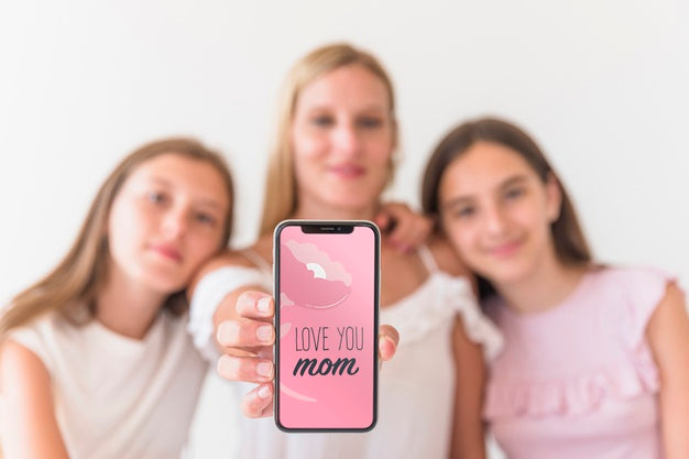 Free Girls Presenting Smartphone Mockup For Mothers Day Psd