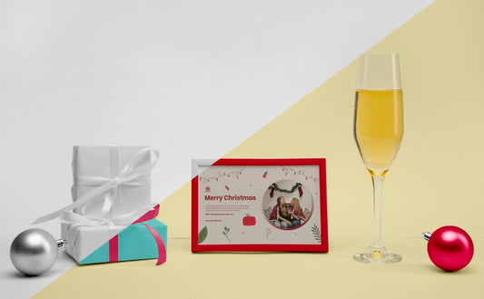 Free Glass Of Champagne Next To A Frame With Mock-Up Psd