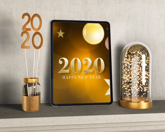 Free Golden Decorations Beside Tablet For New Year Psd