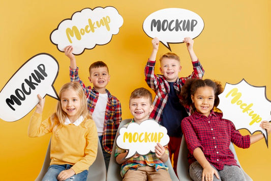 Free Group Of Children Holding Mock-Up Chat Bubbles Psd