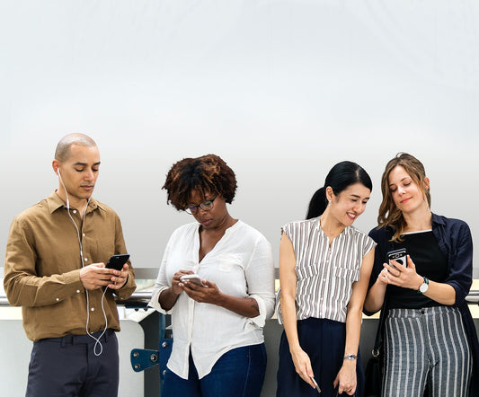 Free Group Of Diverse People Using Smartphones