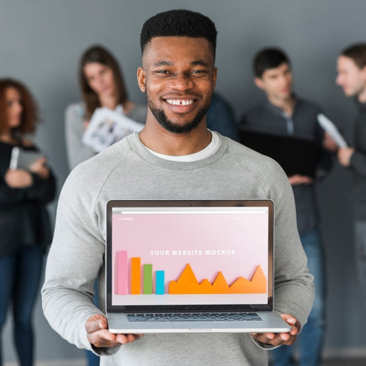 Free Group Of People Holding Laptop Mockup For Charity Psd