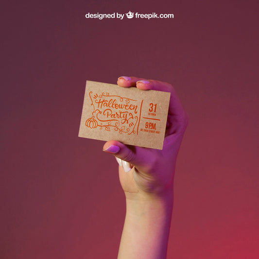 Free Halloween Mockup With Hand Holding Business Card Psd