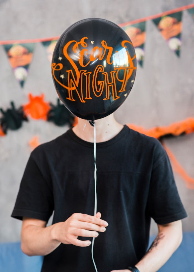 Free Halloween Mockup With Man Holding Balloon Psd