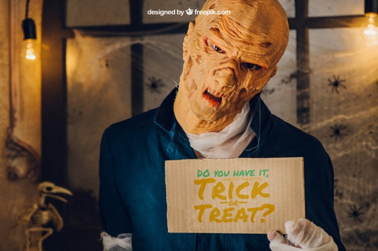 Free Halloween Mockup With Monster Showing Cardboard Psd