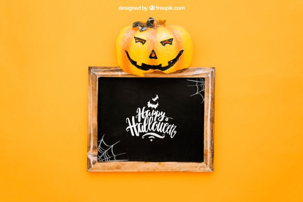 Free Halloween Mockup With Pumpkin Op Top Of Slate Psd