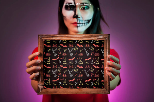Free Halloween Mockup With Woman Holding Slate In Hands Psd