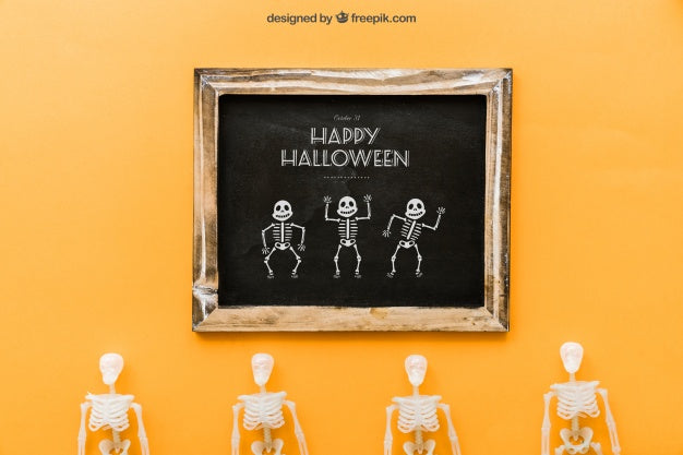 Free Halloween Slate Mockup With Four Skeletons Psd