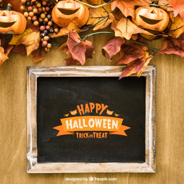Free Halloween Slate Mockup With Laughing Pumpkins On Autumn Leaves Psd