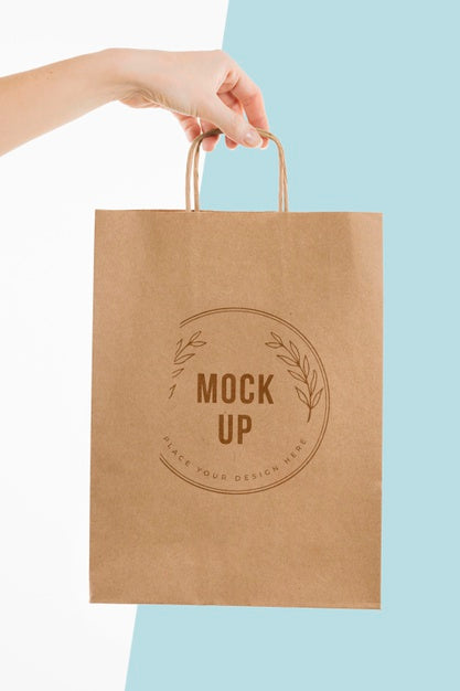 Free Hand Holding A Paper Bag Mock-Up Psd
