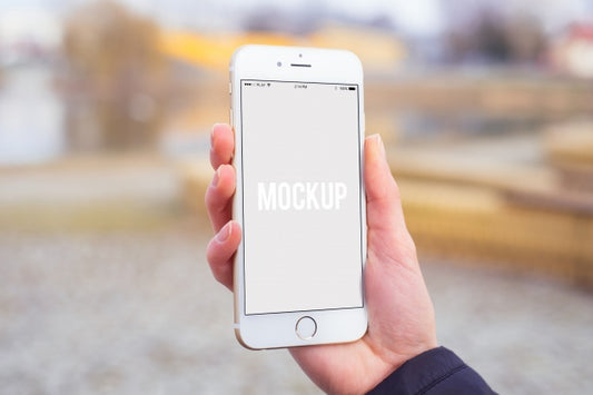 Free Hand Holding A Smartphone Mock Up Psd