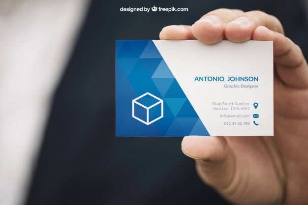 Free Hand Holding a Business Card Mockup
