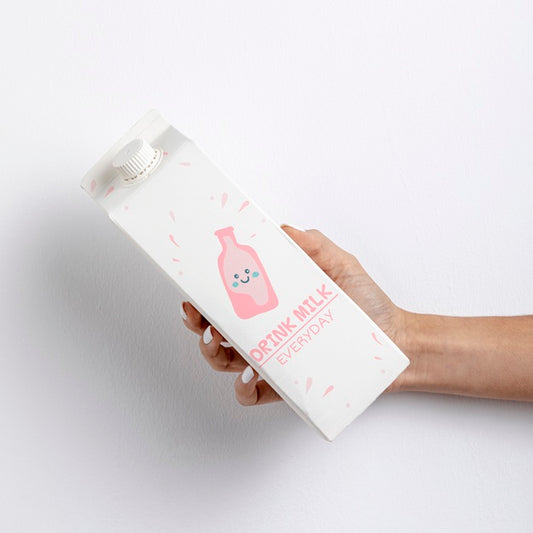Free Hand Holding Carton Of Milk With Mockup Psd