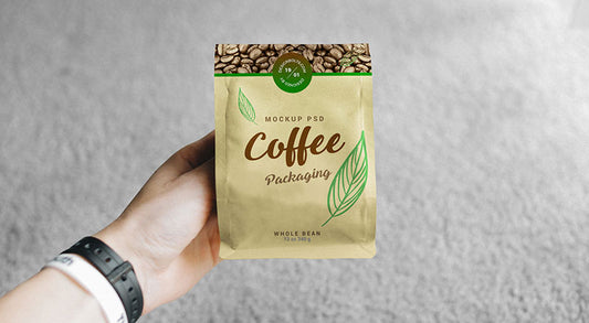 Free Hand Holding Coffee Bag Packaging Mockup Psd