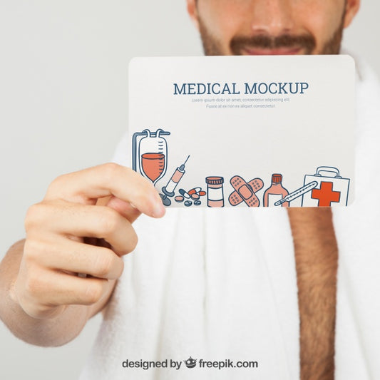 Free Hand Holding Medical Mock Up In Foreground Psd