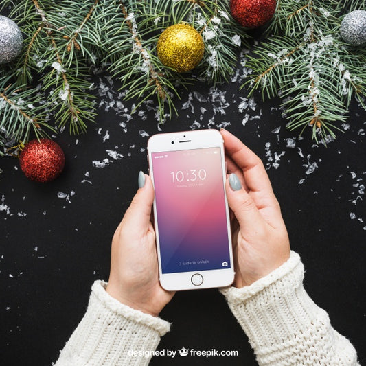Free Hand Holding Smartphone Mockup With Christmas Design Psd